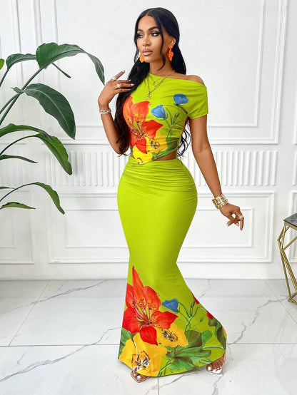 Elegant Women's Summer Fashion Two-piece Set: Bright Floral Print Sleeveless Top and Casual Resort Extra-long Skirt Beachwear
